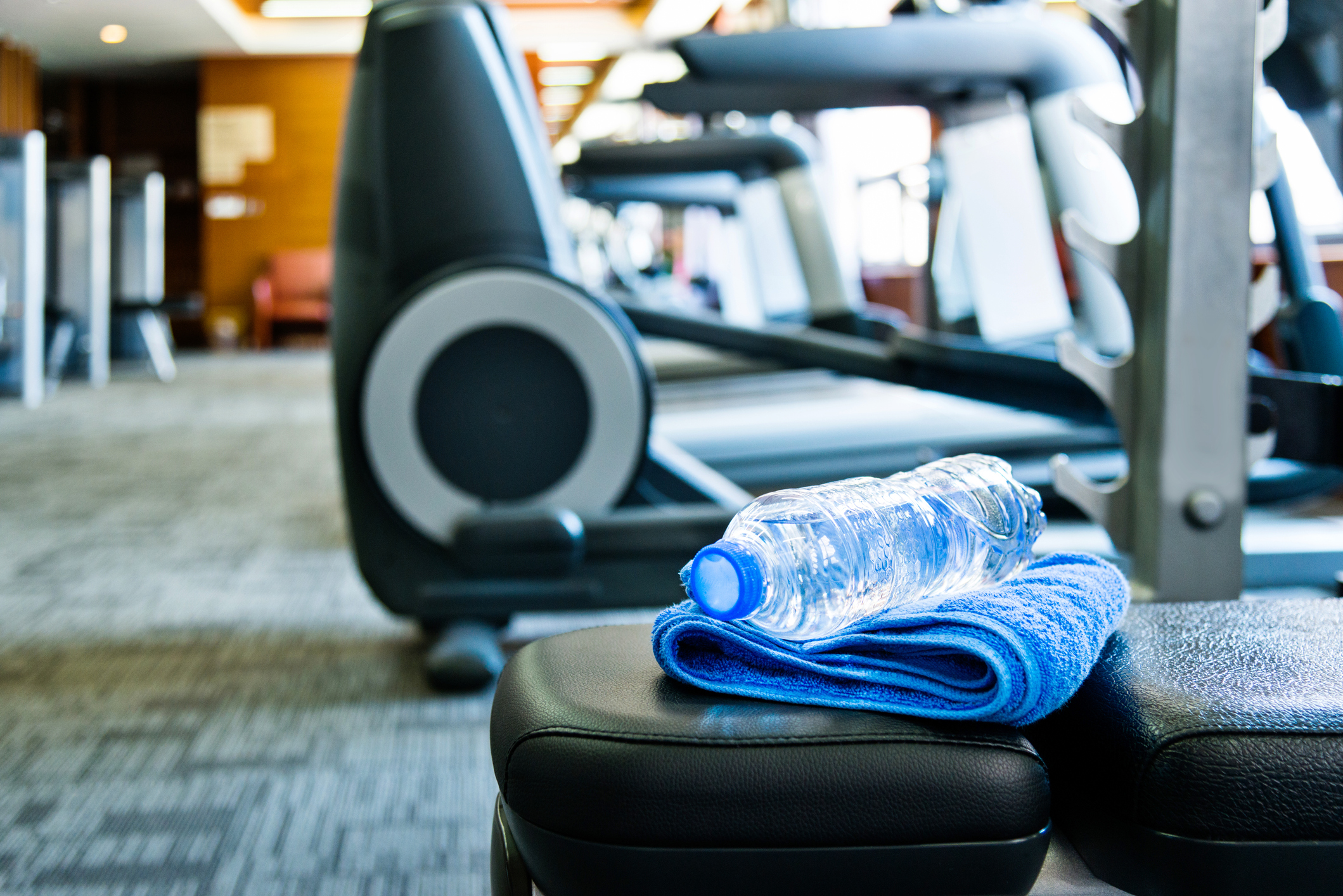 Towel and a bottle of water in gym